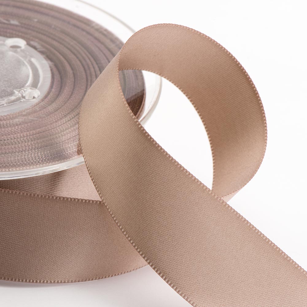 Supplied ribbon inspiration showing taupe satin ribbon on a spool.